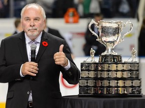 Canadian Hockey League commissioner David Branch stands beside the Memorial Cup during the 2015 Memorial Cup Championship between the Oshawa Generals and the Kelowna Rockets at the Pepsi Coliseum on May 31, 2015 in Quebec City, Que.