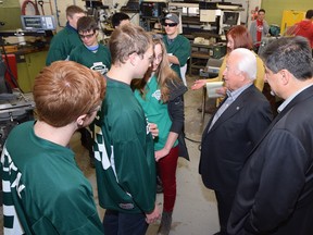 Michael Solcz Sr., founder of Valiant TMS, chats with students at Belle River District High School about their robotics projects for the upcoming Windsor Essex Great Lakes FIRST Robotics Regional.