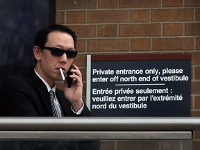 In this file photo, salesman Dennis Lee is shown outside Superior Court of Justice, Feb. 22, 2016, during his fraud and theft trial.