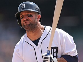 Tyler Collins #18 of the Detroit Tigers reacts after striking out in the seventh inning of the game against the Oakland Athletics on June 4, 2015 at Comerica Park in Detroit, Mich.