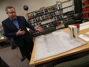 Peter Frise looks over a original copy of the blue prints what would later be known as the Paul Martin Building at the Windsor Public Library in Windsor on Thursday, April 14, 2016. The library has opened a new archive section.