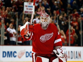 Detroit Red Wings goalie Jimmy Howard acknowledges the crowd after his team defeated the St. Louis Blues 2-1 in overtime in an NHL hockey game in Detroit, Sunday, March 22, 2015.