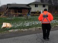 A security guard walks around the premises at 58 Nichols Drive in Blenheim, Ontario, Sunday April 03, 2016. Homeowner Margeret Ardis was found dead in the home last week.