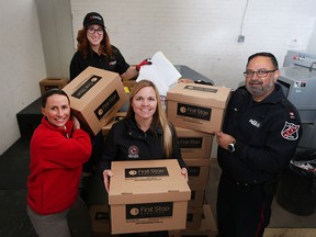 First Stop Services office manger Amber Thibert shreds documents with O.P.P. Const. Amanda Allen, Windsor Police Const. Leigh-Ann Godwin,  LaSalle Police Service Sr. Constable Harbinder Gill during the Crime Stoppers 2016 Take Back Your Drugs & Community Shredding Event kickoff on April 7, 2016.