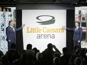 David Scrivano, left, president and CEO of Little Caesars and Christopher Ilitch, president and CEO of Ilitch Holdings, Inc., unveil the name of the Detroit's new 20,000-seat downtown arena during a news conference, Thursday, April 28, 2016, in Detroit.