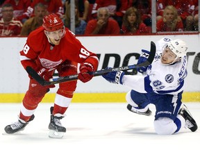 Detroit Red Wings centre Joakim Andersson (18) takes a shot as Tampa Bay Lightning defenceman Nikita Nesterov (89) defends in the second period of Game 3 in a first-round NHL hockey Stanley Cup playoff series on April 17, 2016 in Detroit.