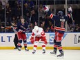 Darren Helm #43 of the Detroit Red Wings reacts as the New York Rangers celebrate a third period goal by Kevin Hayes #13 (l) against the Detroit Red Wings at Madison Square Garden on April 9, 2016 in New York City.