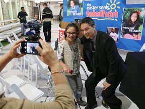 2016 Easter Seals Windsor-Essex Telethon co-ambassador  Angelina Boschin poses for photo with co-host Bob Bellacicco during the 2016 Easter Seals Telethon media event held at Central Park Athletics in Windsor.