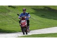 In this file photo, an e-biker zips along a Windsor, Ont. waterfront Thursday, Aug. 25, 2011.  (DAN JANISSE/The Windsor Star) CRUISER