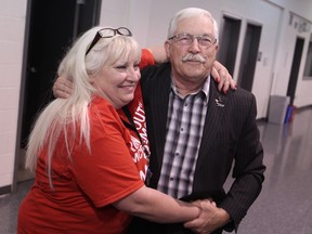 Essex mayor Ron McDermott is embraced by his daughter Pam McDermott at Essex Arena after being re-elected as mayor on April 27, 2014.