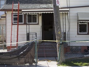 Yellow tape surrounds a house at 402 Alymer Ave. after an early morning fire caused extensive damage, Saturday, April 23, 2016.  No one was injured in the blaze.