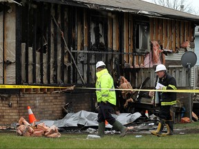 The Ontario Fire Marshall investigates a suspicious fire on Emerson Street in Leamington on Wednesday, April 6, 2016.