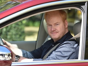 Standup comedian Jim Gaffigan sits behind the wheel of a new Chrysler Pacifica.