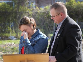 The Habitat for Humanity Windsor-Essex held a groundbreaking ceremony on Saturday, April 16, 2016, in Windsor, ON. The project will be on Meldrum Road. An emotional Charmaine Nippers wipes a tear as Mike Van der Vlist, executive director of the Habitat group looks on.