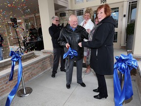 Ross Barnwell, John Ingratta, Cheryl Dieter, Carol Derbyshire and Joan McSweeney (left to right) cut a ribbon outside the new Hospice in Leamington on Wednesday, April 6, 2016. The satellite facility was opened to public before patients begin arriving next week.
