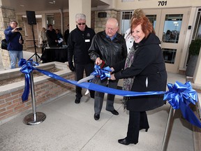 Ross Barnwell, John Ingratta, Cheryl Dieter, Carol Derbyshire and Joan McSweeney (left to right) cut a ribbon outside the new Hospice in Leamington on Wednesday, April 6, 2016. The satellite facility was opened to public before patients begin arriving next week.