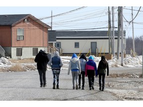 In the wake an epidemic of suicide attempts in Attawapiskat - including 11 young people last Saturday and a foiled suicide pact earlier this week - this remote Ontario reserve of 2,000 people declared a state of emergency over the weekend.  Today (April 13, 2016), Ontario's Minister of Health, Eric Hoskins, arrived on the reserve, along with Tracy MacCharles (Minister of Children and Youth) and Chief of the Assembly of First Nations, Perry Bellegarde, to hatch out solutions. They include an immediate two million dollars in emergency funding, plans to build a youth centre and other long-term strategies.  (JULIE OLIVER/POSTMEDIA)
