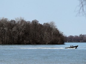 A boat cruises out into lake St. Clair in Windsor on Thursday, April 14, 2016.