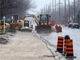 Construction crews get to work on Todd Lane in LaSalle, Ont., near the Herb Gray Parkway on Dec. 1, 2015.