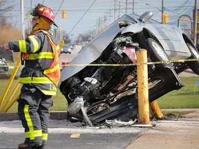 An man was taken to hospital with minor injuries after crashing his car into a pole in the 1300 block of Lauzon Rd. on Monday, April 4, 2016, in Windsor, ON. The accident occurred at approximately 5:15 p.m. A Windsor firefighter is shown at the scene.