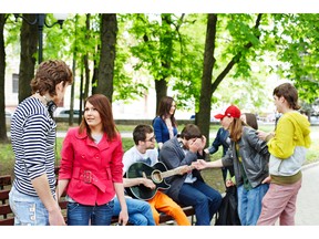 Listening to music in city park. Photo by fotolia.com.