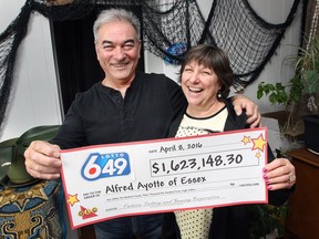 Alfred and Deborah Ayotte pose with their ceremonial winning lottery cheque for over $1.6 million on Monday, April 11, 2016, at their Essex, Ont. home. Alfred has been playing the same numbers for over 30 years and finally hit the Lotto 649 draw last week.