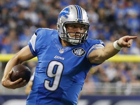 Detroit Lions quarterback Matthew Stafford (9) points as he scrambles during an NFL game on Sunday, Nov. 22, 2015, in Detroit.