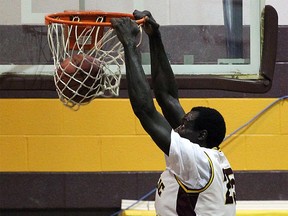 Jonathan Nicola dunks a basketball as a student of Catholic Central High School in a game on March 7, 2016.