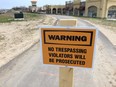 A sign warning people to stay off the Herb Gray Parkway trails is shown on April 20, 2016. Parkway officials are warning people to stay off the trails until landscaping work is completed.