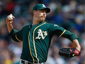 Relief pitcher John Axford #61 of the Oakland Athletics pitches against the Seattle Mariners at Safeco Field on April 10, 2016 in Seattle.