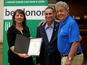 Windsor-Essex Gift of Life Association chairperson Niva Segatto presents the Community Champion award to Giovanni Caboto Club president Dennis Segatto and board member Rick Buzzeo at the Caboto Club on Wednesday, April 6, 2016. The award was given to Dennis Segatto and the club's board of directors in recognition of their outstanding effort to champion the cause of organ and tissue donation.