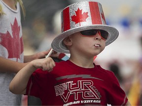 Dominick Barry, 4, shows his colours while cheering on the participants of the Canada Day Parade on Wyandotte St. East,  last year.  (DAX MELMER/The Windsor Star)