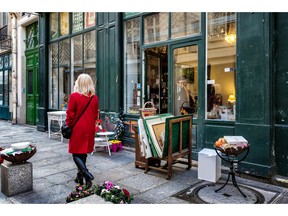 PARIS, FRANCE - JAN. 3, 2014: Antique shop on a side street in the historic neighborhood of Le Marais. Items for sale on the sidewalk. Photo by fotolia.com.