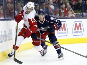 Detroit Red Wings' Pavel Datsyuk, left, and Columbus Blue Jackets' Alexander Wennberg chase a loose puck during an NHL game in Columbus, Ohio on March 17, 2016.