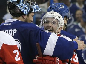 Detroit Red Wings centre Pavel Datsyuk, right, hugs Tampa Bay Lightning goalie Ben Bishop after the Lightning eliminated the Wings in the first round of the NHL playoffs on April 21, 2016 in Tampa, Fla.