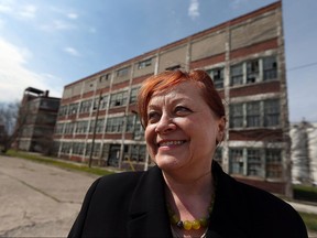 Real estate agent Barbara Oczachowski tours the Walker Power Building in Windsor on Tuesday, April 20, 2016. The building, which was built in 1911, has been sold.