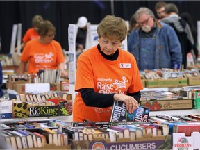 It was another busy weekend for the Windsor Star Raise-A-Reader book sale at the Devonshire Mall on Saturday, April 16, 2016. Denise Brown, a volunteer for the sale arranges some of the books.