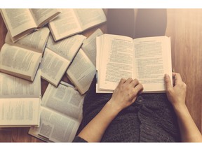 Reading some books on the floor. Photo by fotolia.com.