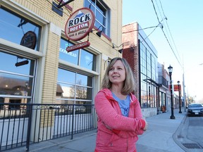 Nicole Sekela is shown April 15, 2016 in front of Rock Bottom Bar and Grill and the new Sandwich Brewing Company - two businesses on Sandwich Street she owns with her brother.