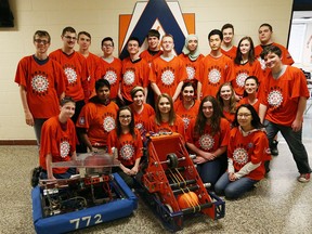 Members of the Sabre Bytes Sandwich Secondary School robotics team pose with a prototype of a robot that will demonstrated in the Windsor-Essex Great Lakes Regional Robotics Competition.  Robotics teams from across Canada, the United States and Poland will compete.