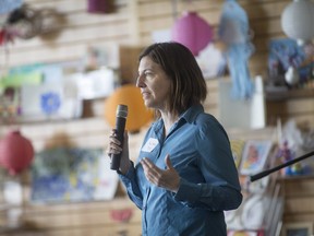 Amy Tesolin, co-chair of Teachers for Global Awareness, speaks during Ashes Transformed: Social Justice Through Art, at the Art Gallery of Windsor, Satruday, April 2, 2016.