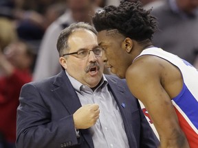 Detroit Pistons head coach Stan Van Gundy talks with Detroit Pistons forward Stanley Johnson during the first half against the Dallas Mavericks, Friday, April 1, 2016, in Auburn Hills, Mich.