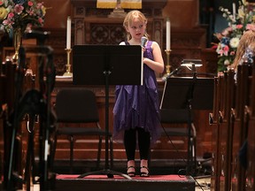 The Windsor Symphony Orchestra and Downtown Music Initiative presented a performance on Wednesday, April 13, 2016, showcasing the young musicians involved in the program. The DMI is a community program run by volunteer musicians who offer free music lessons to youth from low income families. Aven Nicole Miller sings during the event.