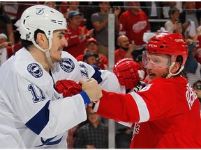 Brian Boyle (11) of the Tampa Bay Lightning looks for a fight with Justin Abdelkader (8) of the Detroit Red Wings after the conclusion of Game 3 of their NHL playoff game at Joe Louis Arena on April 17, 2016 in Detroit.