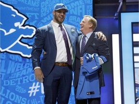 Ohio State's Taylor Decker poses for photos with NFL commissioner Roger Goodell after being selected by the Detroit Lions as the 16th pick in the first round of the 2016 NFL football draft, Thursday, April 28, 2016, in Chicago.