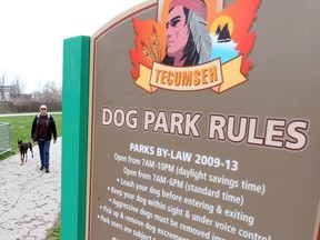 Frank Quiring walks with his son's dog Baxter at the Tecumseh Dog Park in Tecumseh on April 26, 2016.