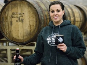 Natalie Lahoud displays the newly released Easy Stout 365 at the Walkerville Brewery in Windsor, Ont. on Thursday, April 7, 2016. The Stout gets its name from it being fermented for a total of 12 months or 365 days in a year.