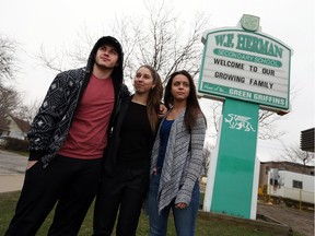 Jake Mayea, left, Hailey Dugal and Jayda Gelinas are shown in front of W.F. Herman Secondary School in Windsor on April 4, 2016. The students are upset about a proposed name change for the school.