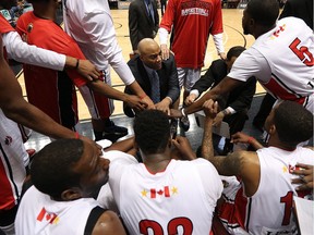 Windsor Express coach Bill Jones chats with his team on the sideline as they take on the London Lightning at the WFCU Centre in Windsor March 3, 2016.