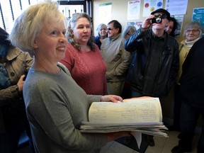 Philippa von Ziegenweidt, left, and other concerned residents converge at the constituency office of MPP Lisa Gretzky Friday April 15, 2016.  The local group is petitioning to restart site selection process for Windsor and Essex County's new, mega-hospital.